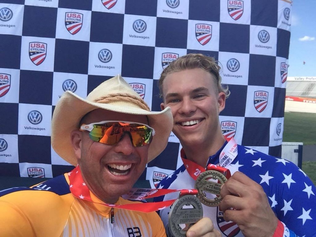 Karl Baumgart (left) and Dominic Suozzi celebrate their time trial medals at elite track nationals.